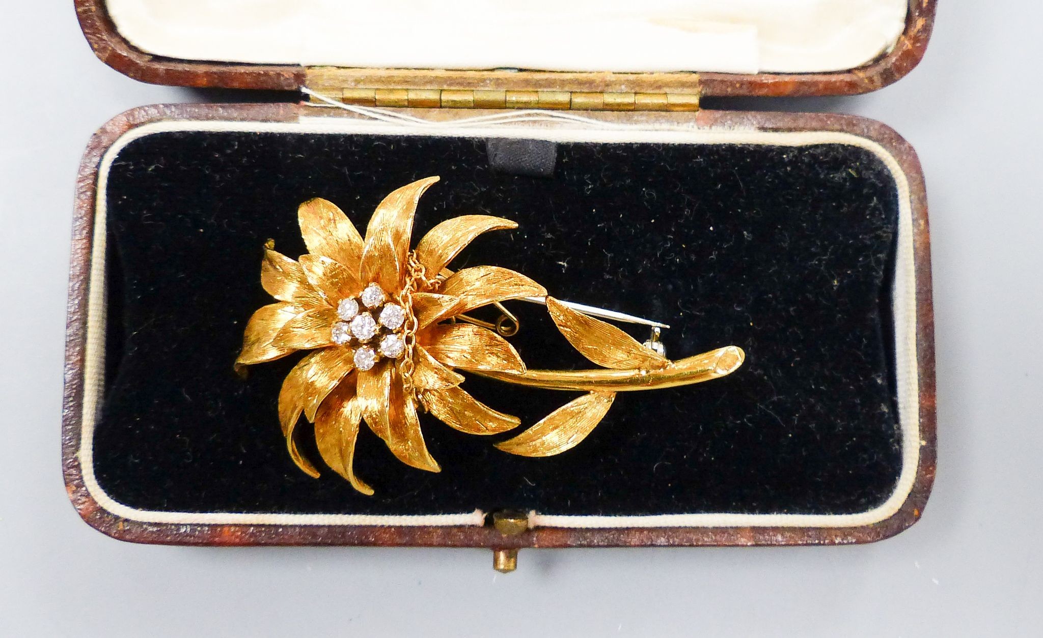 An early 1970's 18ct gold and seven stone diamond set flower brooch, by Cropp & Farr, London, 1972, 52mm.